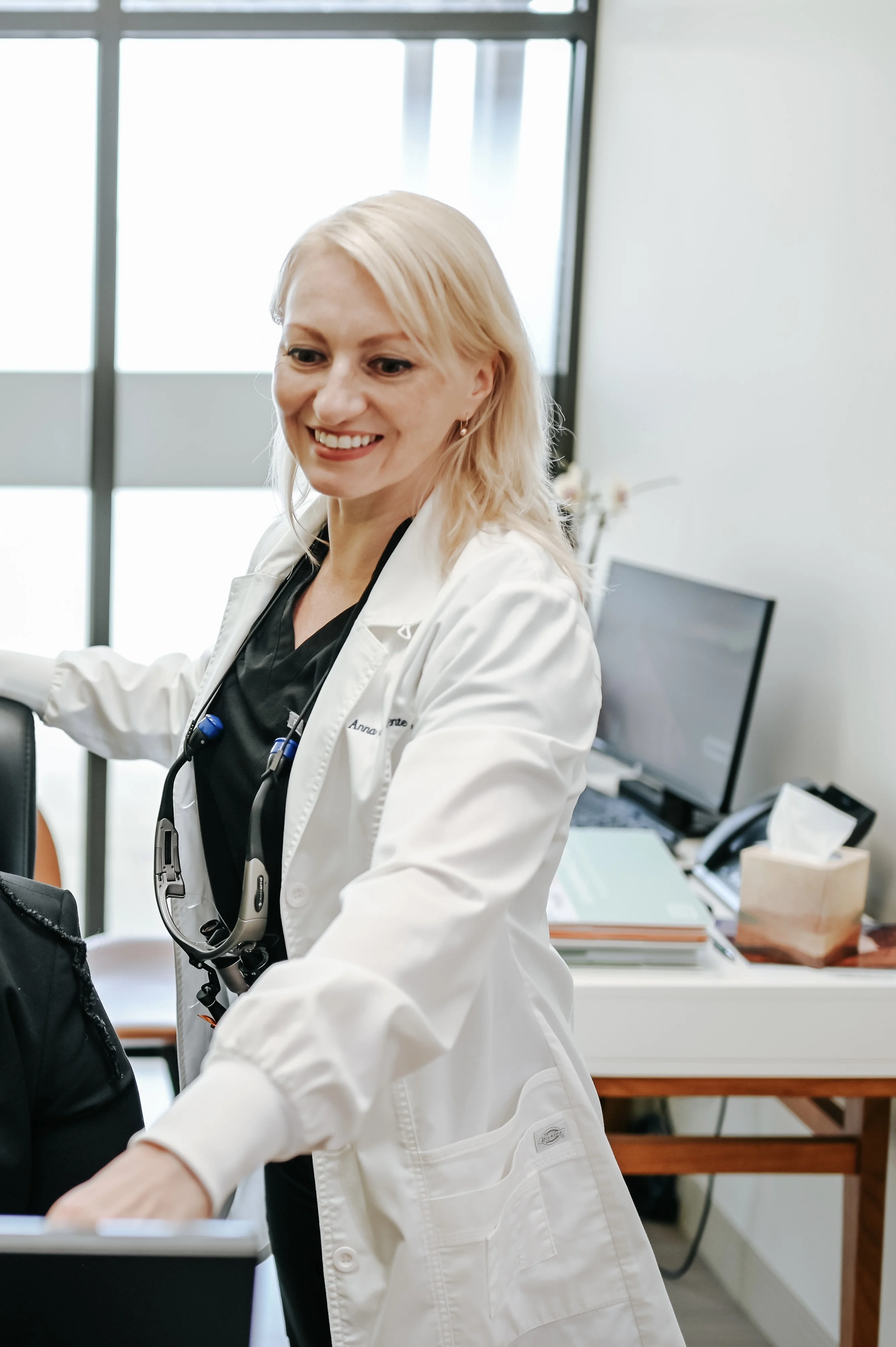 Dr. Anna de la Fuente smiling in the office
